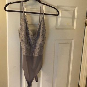 Purple lace body suit
